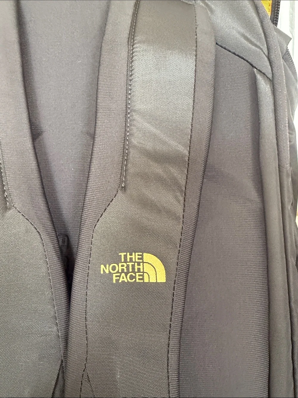 The North Face Black Backpack with Gold Logo Accent Kaban